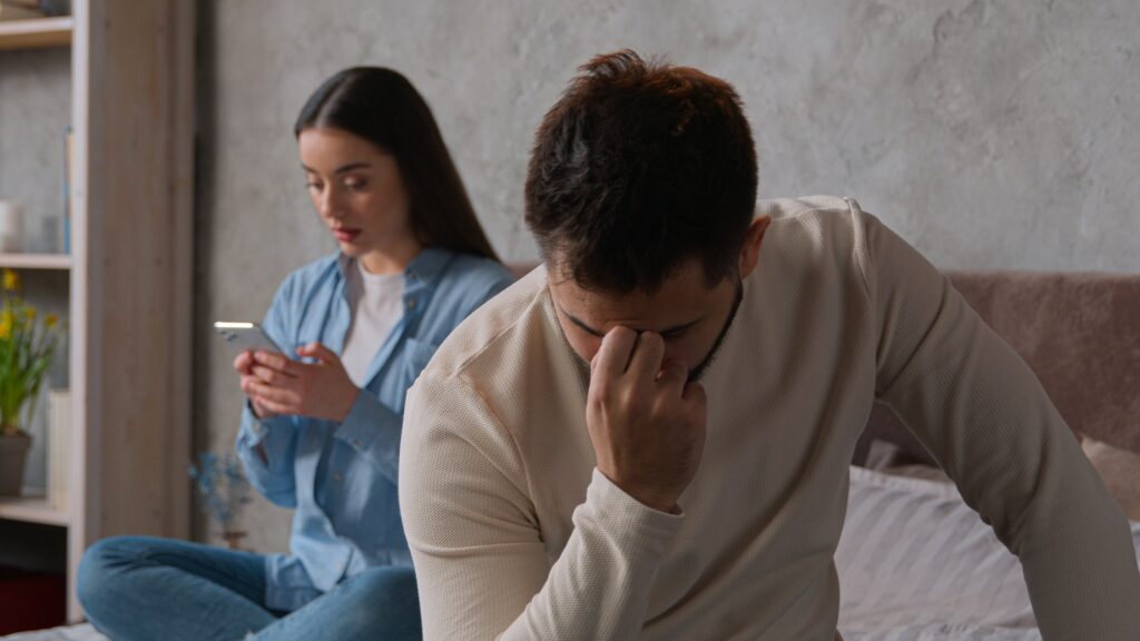 Caucasian couple problem relationship sad upset man sit separate from woman on bed offended on wife