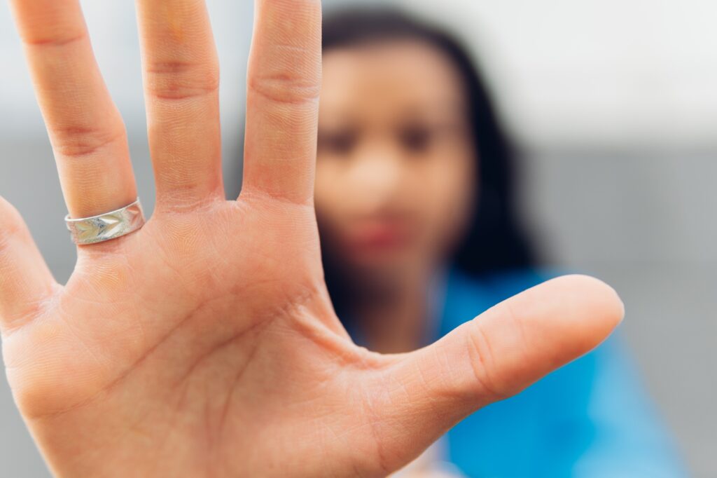 Close-up of a woman's palm, makes the hand stop the denial gesture