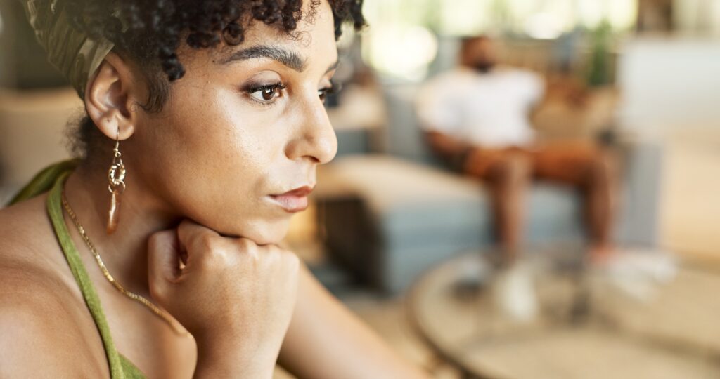 Couple, divorce and sad woman thinking in house with anger, stress or cheating, control or toxic cr